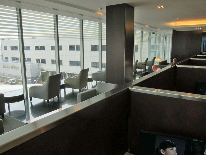 Floor-to-ceiling windows and chairs facing outwards: some of the best views in the terminal.