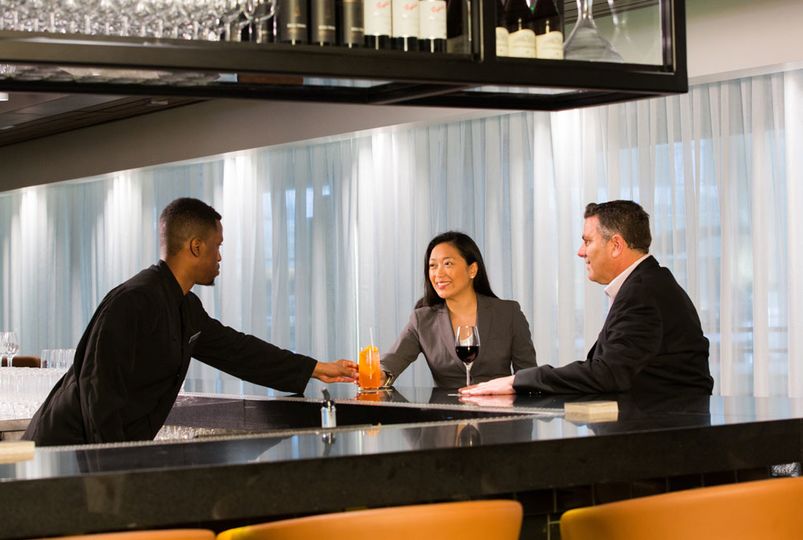 Enjoy a preflight cocktail together at the Qantas Business Lounge, Los Angeles