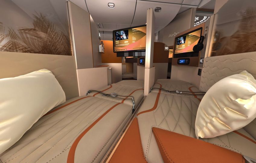 The upper half of adjacent Galaxy business class window seats can become a shared space.