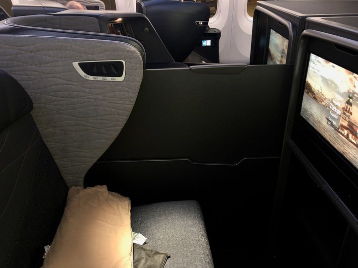 If you want privacy rather than sociability in the middle seats, raise this divider panel.