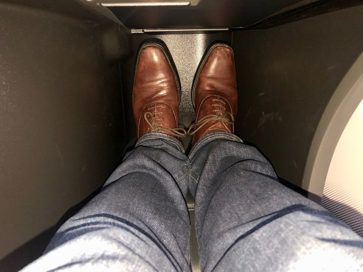 The less-spacious foot cubby in rows 2 through 8 of Turkish Airlines' Boeing 787 business class.