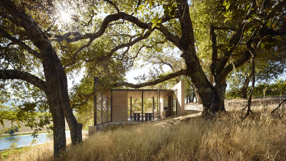 A wood-and-glass tasting pavilion at Quintessa.