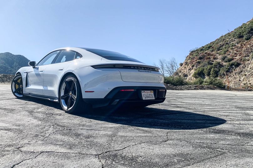 The rear of the car has a band of red tail lights and a dynamic spoiler that lifts at speed.