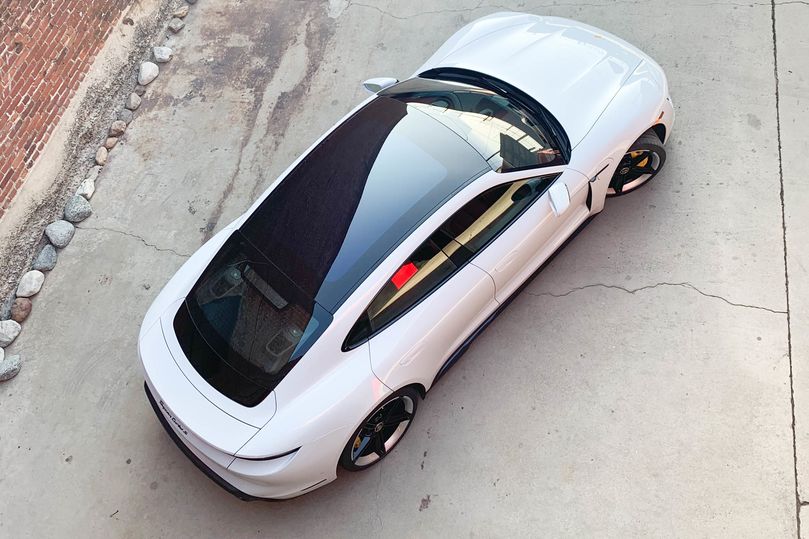 The glass of the sunroof stretches the length of the car.