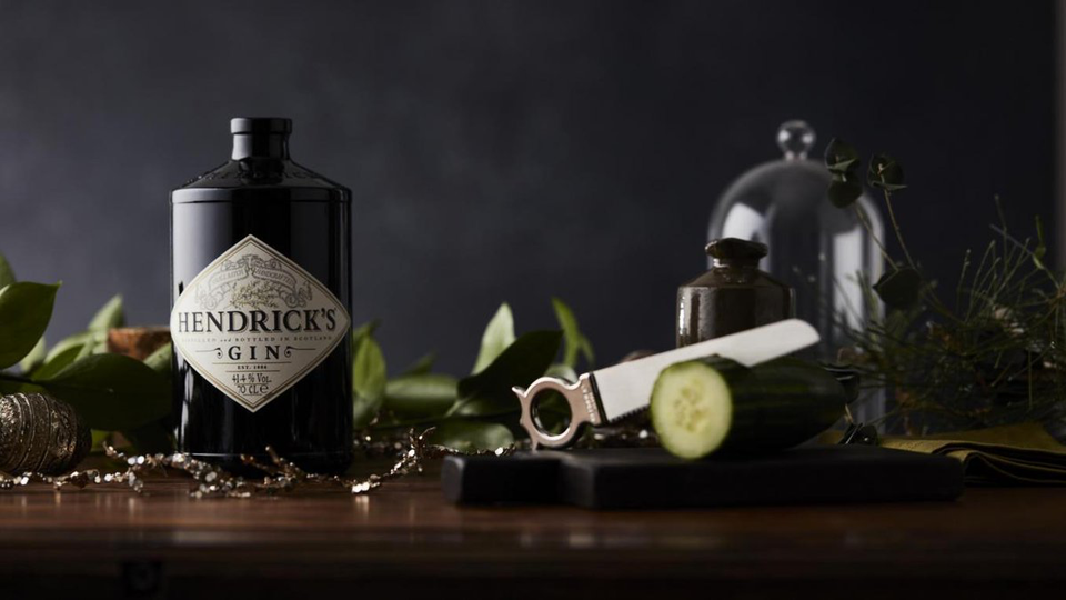 Hendrick's is a flavoured or infused gin, macerated with rose petals and cucumber.