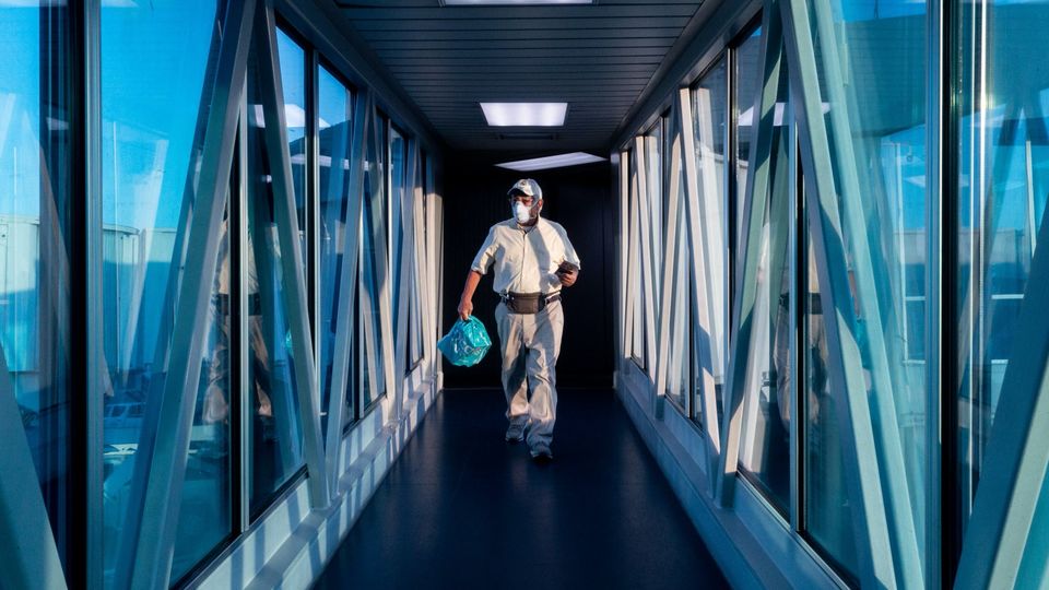 A traveler walks along a jet bridge at Tocuman International Airport in Panama City, Feb. 28.