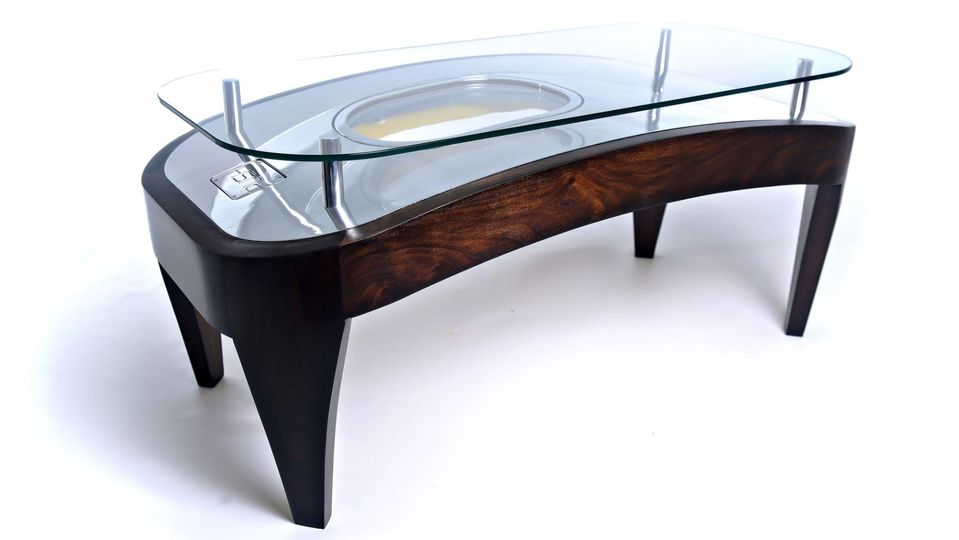 This Airbus A320 emergency exit door has been converted into a coffee table.. Plane Industries