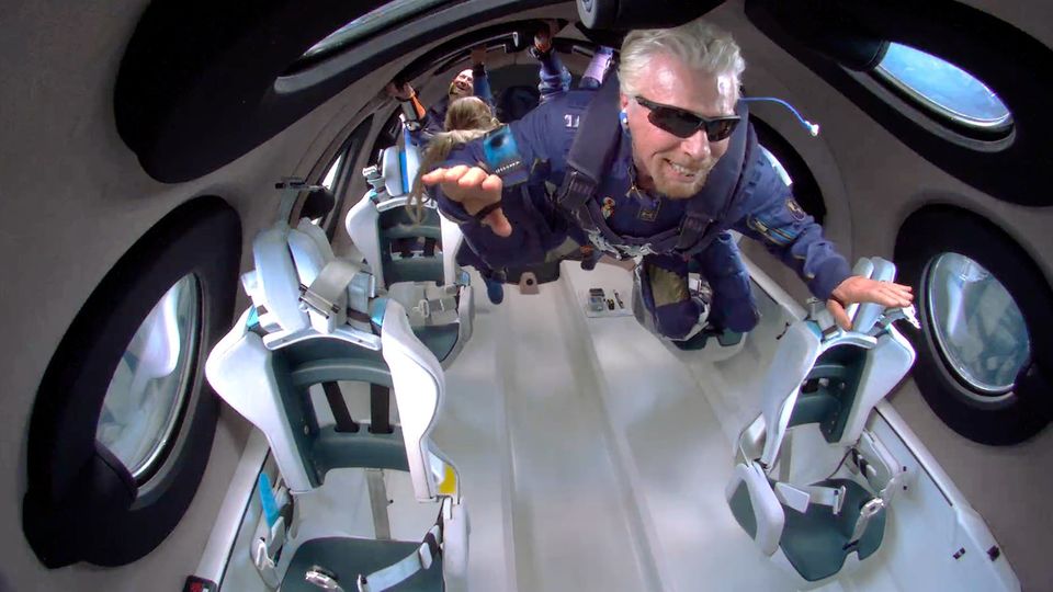 Richard Branson test-drives space tourism board Virgin Galactic's VSS Unity.