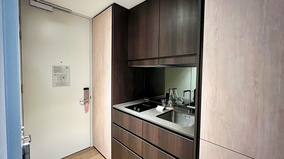 The kitchenette is like a Swiss Army Knife, with utensils tucked neatly out of sight.