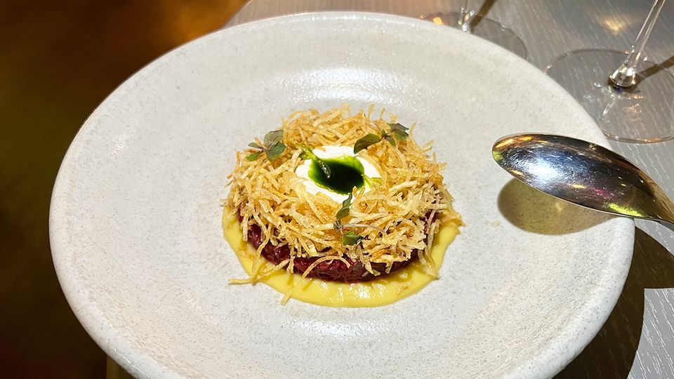 Beetroot tartare with macadamia ricotta and a golden beet emulsion.