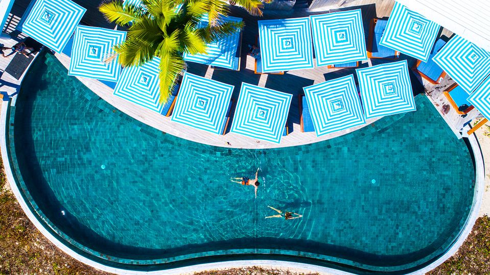 Alternate between the infinity pool and the warm waters surrounding the island.. Malamala Beach Club