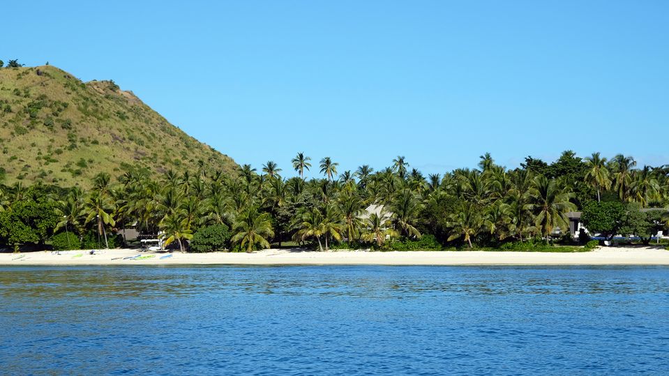 Villas are dotted amid the palm-filled gardens.