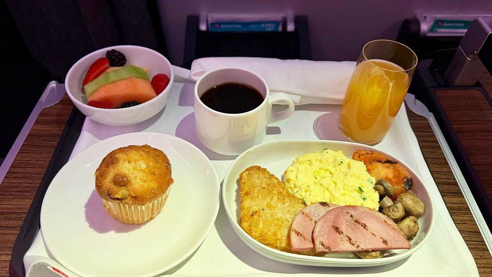 A muffin and fruit salad complete the breakfast service.