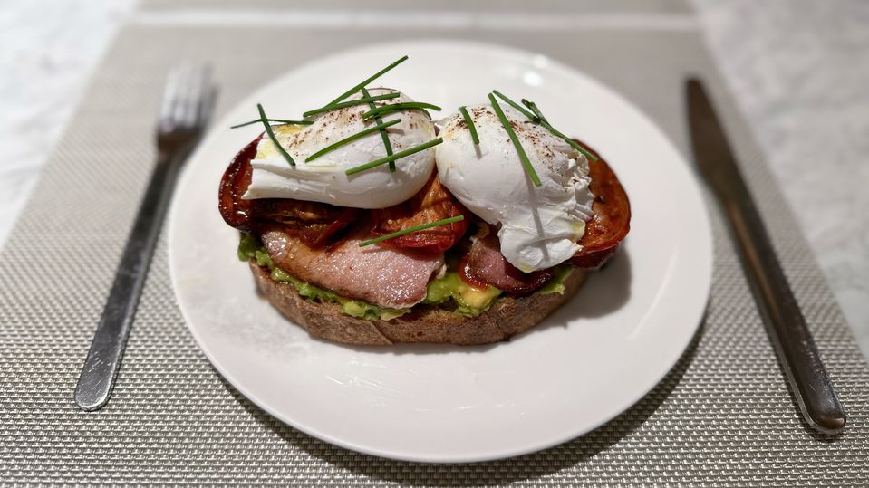 Poached eggs, smashed avocado and bacon.