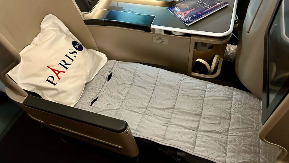 The padded mattress topper makes the business class seat even more comfortable.