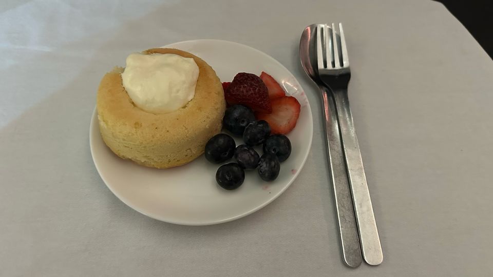 Rum savarin with Chantilly cream and berries.