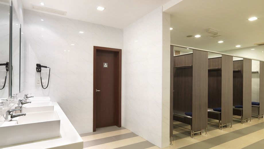 (Each shower cubicle does have a door, even though they're all open in this photograph.)